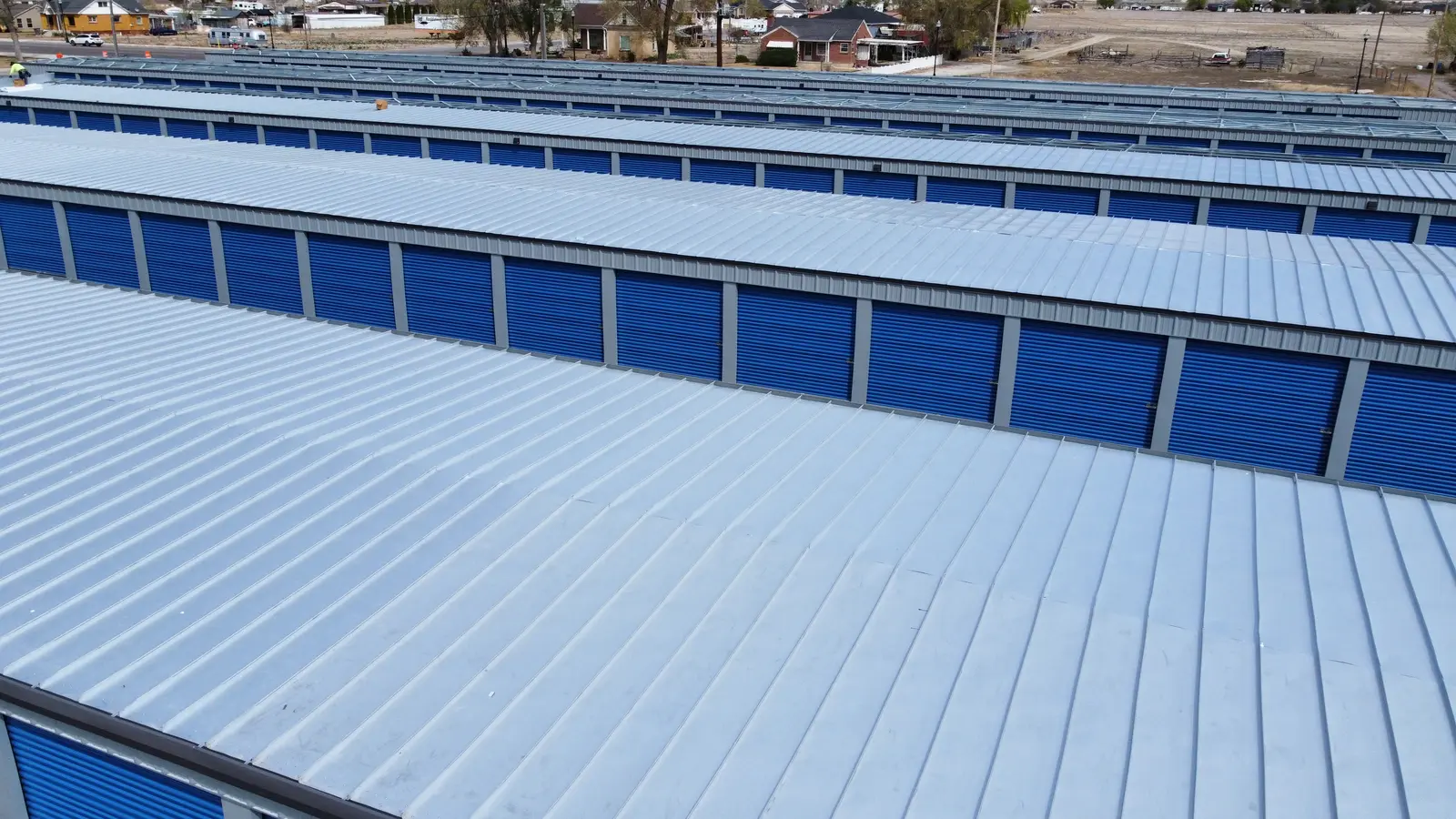 Roll-up doors on a steel self-storage building along the drive lane in Centerfield