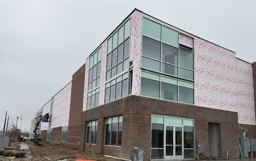 Glass storefront and brick facade going up on the Timp Hwy Self Storage building, Lehi Utah