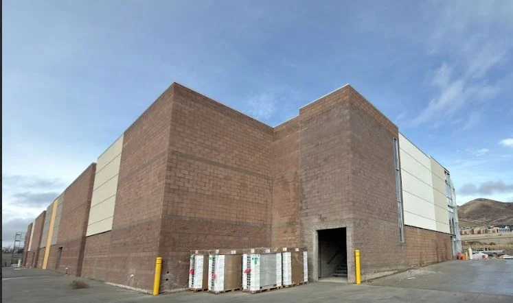 Completed brick exterior of the multi-story Timp Hwy Self Storage facility during construction, Lehi Utah