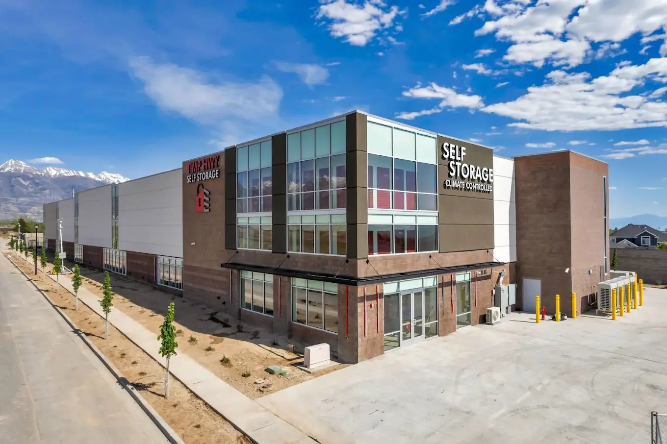 Completed Timp Hwy Self Storage in Lehi, Utah, a 3-level climate-controlled self-storage facility with the snowcapped Wasatch mountains behind