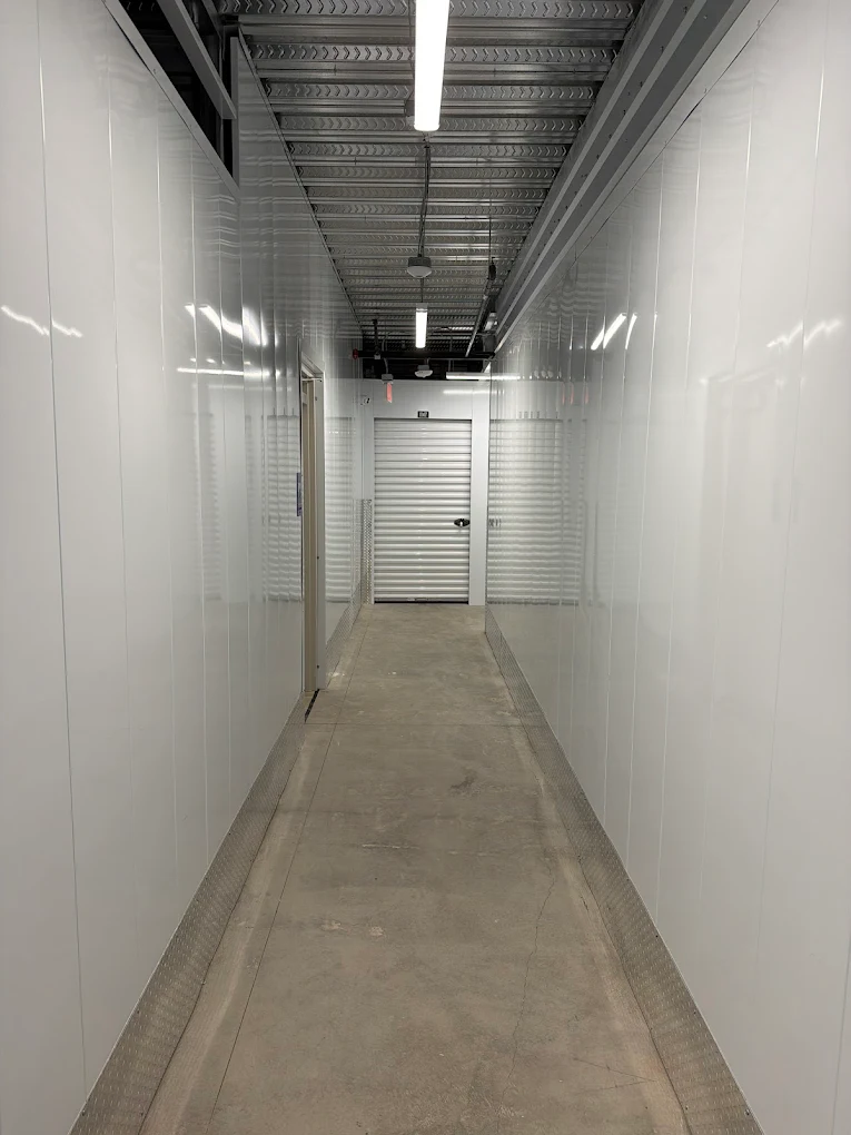 Bright white climate-controlled storage corridor at Timp Hwy Self Storage, Lehi Utah