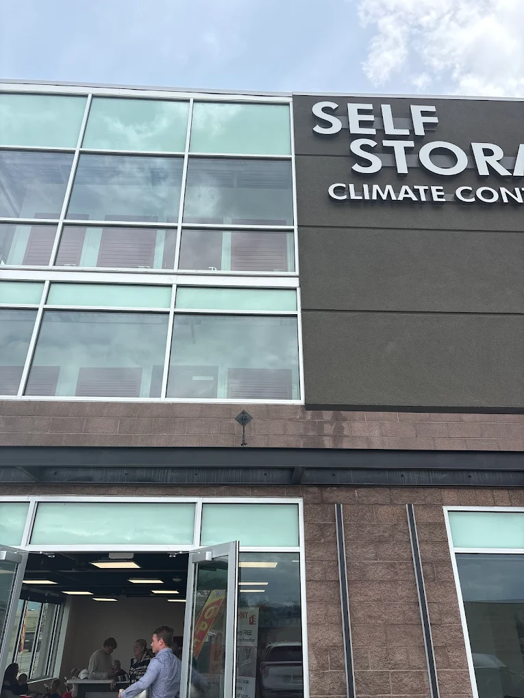 Leasing office entrance of the finished Timp Hwy Self Storage in Lehi, Utah, below the climate-controlled storage signage